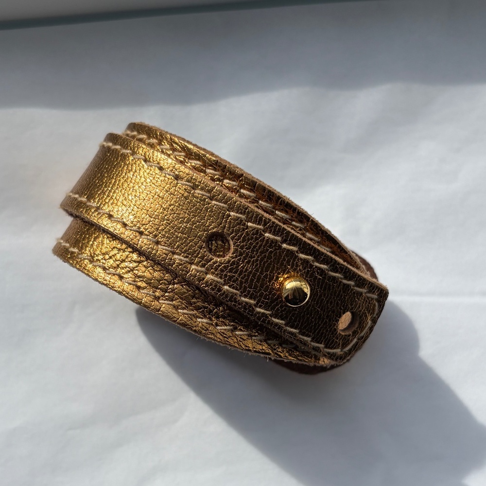 Gold leather bracelet band.